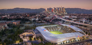 An aerial view of BMO Stadium and the Los Angeles skyline