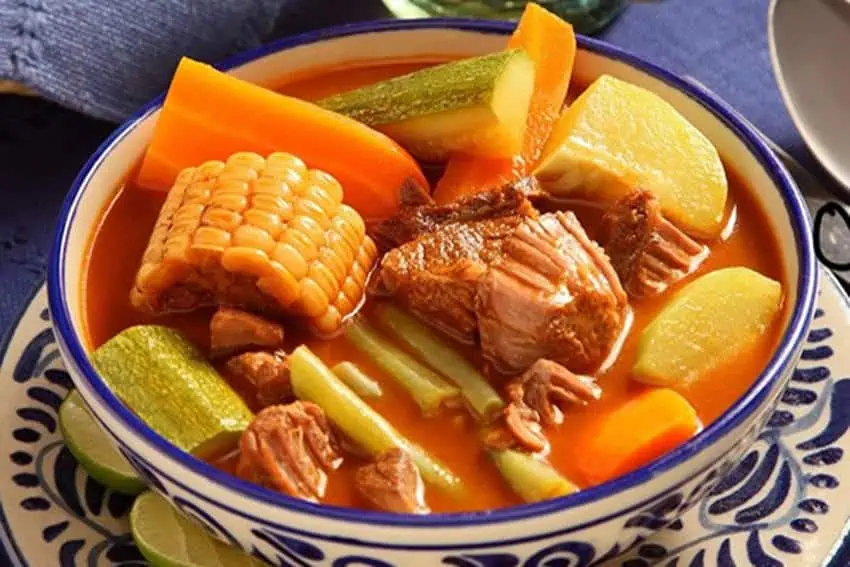 A bowl of mole de olla in a traditional mexican ceramic bowl.
