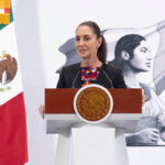 Sheinbaum stands at a podium during her morning press conference or mañanera