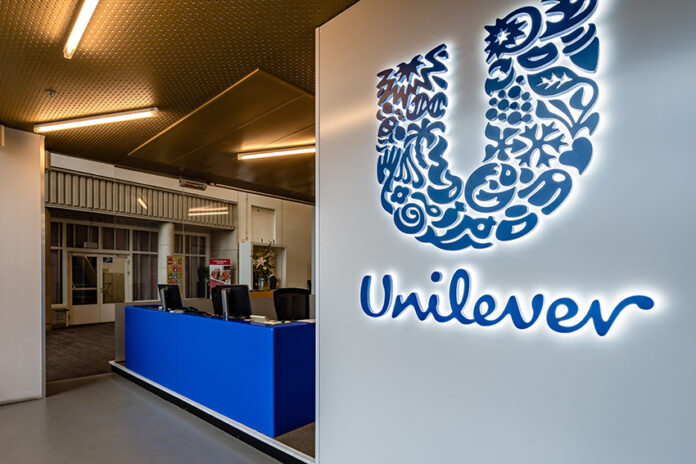 A Unilever logo at the entrance of an office