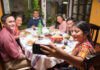 A Mexican family eats food together and enjoys a meal