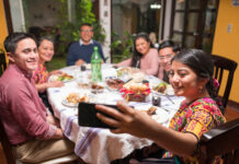 A Mexican family eats food together and enjoys a meal