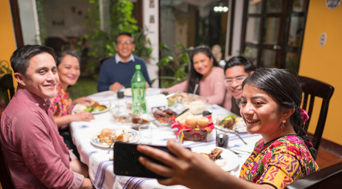 A Mexican family eats food together and enjoys a meal
