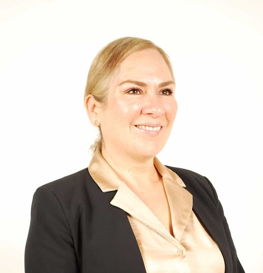 A portrait of a blond woman in business clothes