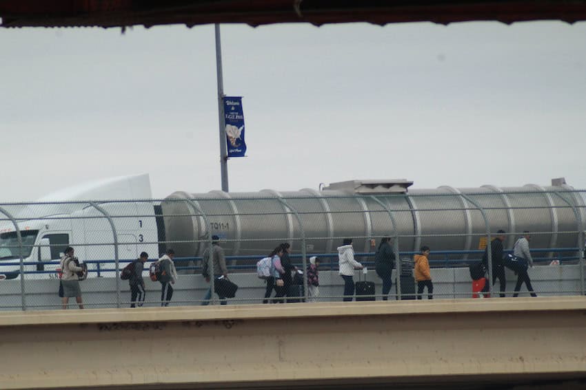 pedestrian along bridge