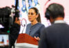 A camera films Sheinbaum as she speaks at her morning press conference