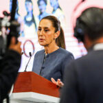 A camera films Sheinbaum as she speaks at her morning press conference