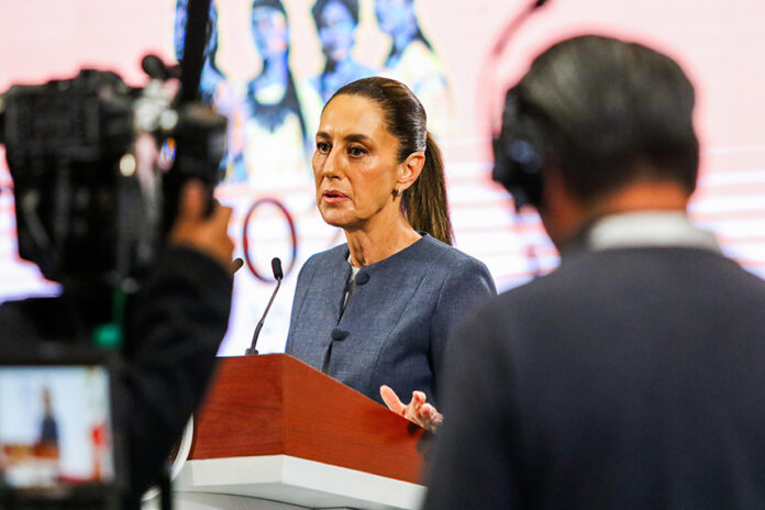 A camera films Sheinbaum as she speaks at her morning press conference