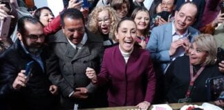 At the end of her press conference, Sheinbaum shared cake with the scores of reporters and other people in attendance