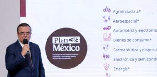 Economy Minister Marcelo Ebrard shares a slide reading Plan Mexico at a press conference