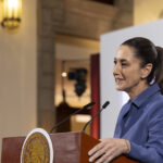 President Claudia Sheinbaum at the podium of her morning press conference