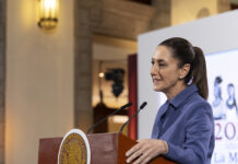 President Claudia Sheinbaum at the podium of her morning press conference