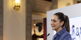 President Claudia Sheinbaum at the podium of her morning press conference