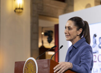President Claudia Sheinbaum at the podium of her morning press conference