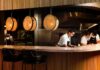 restaurant workers behind a counter