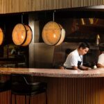 restaurant workers behind a counter