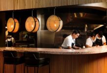 restaurant workers behind a counter