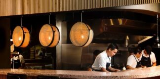restaurant workers behind a counter