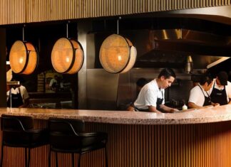 restaurant workers behind a counter