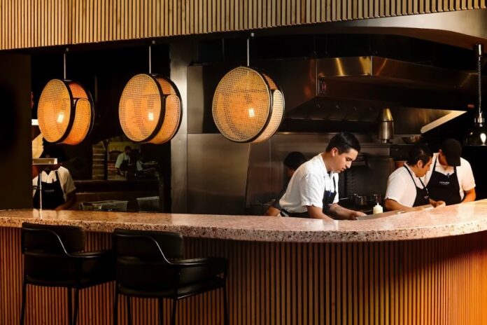 restaurant workers behind a counter