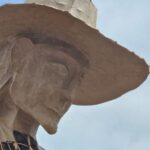 head of a statue of a searching mother in england