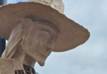 head of a statue of a searching mother in england