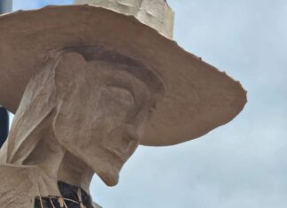 head of a statue of a searching mother in england