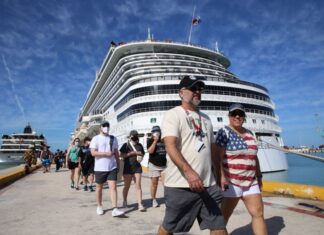 Tourists walking near cruise ship