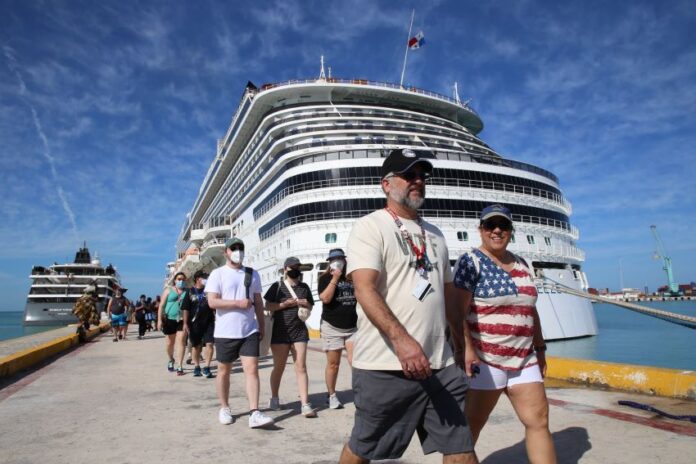 Tourists walking near cruise ship