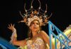 A carnival queen dances in an elaborate starfish costume