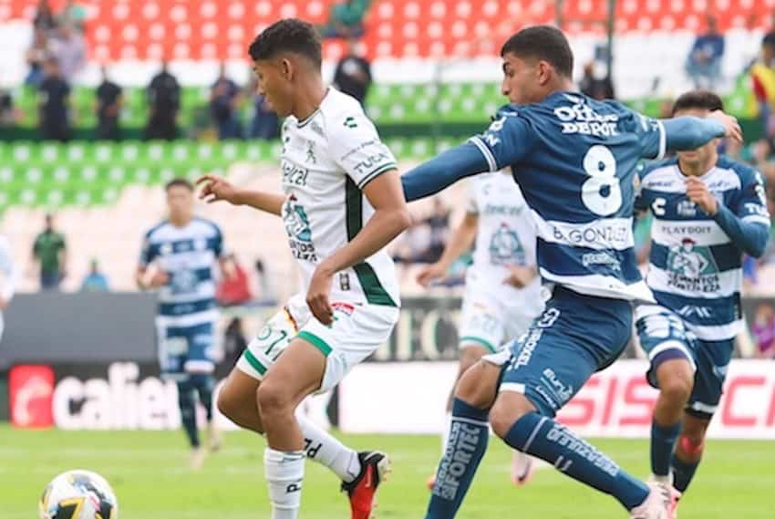 two soccer players in action