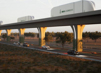 A rendering shows cargo containers moving along an automated freight corridor guideway above a highway