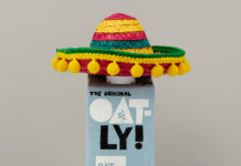 A bottle of oatly oat milk in a mexican sombrero