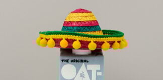 A bottle of oatly oat milk in a mexican sombrero