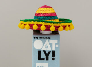 A bottle of oatly oat milk in a mexican sombrero