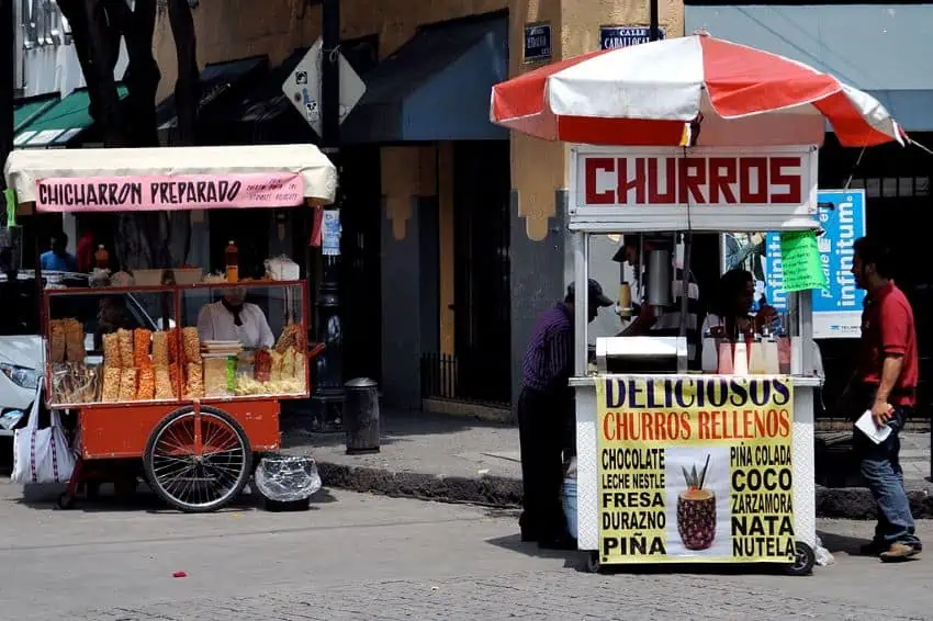 Churro and chicharron stands on a street