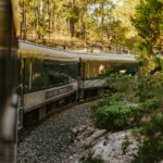 Carriages of Mexico's El Chepe train riding through the Copper Canyon.