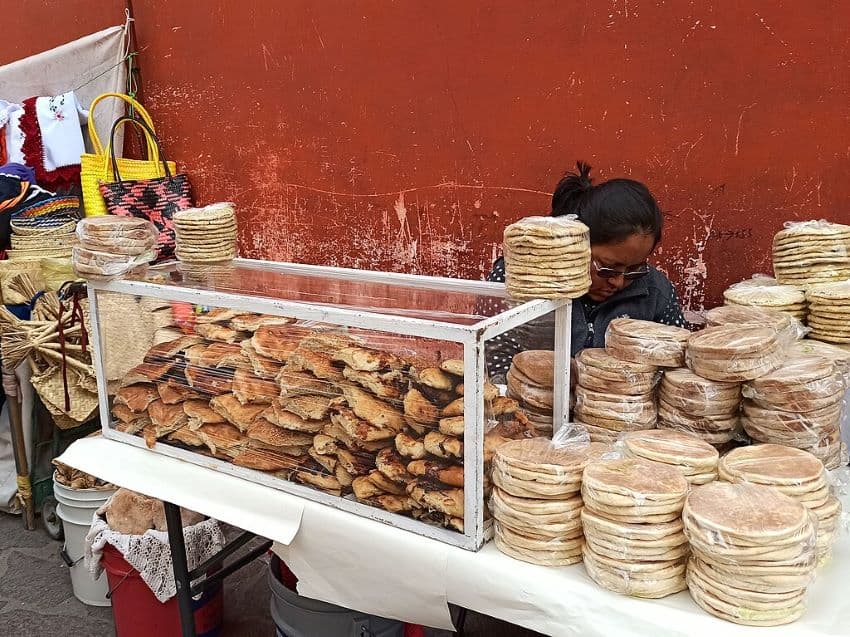 Sweet gorditas stacked to be sold by a street vendor