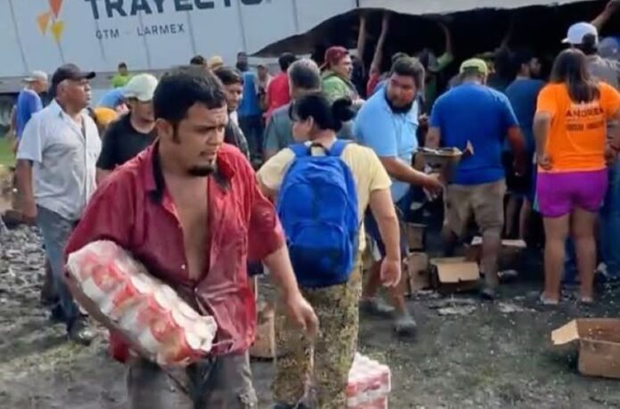 crowd carrying away beer cartons