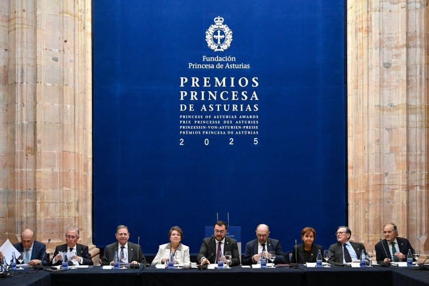 Men and women sitting on a dais