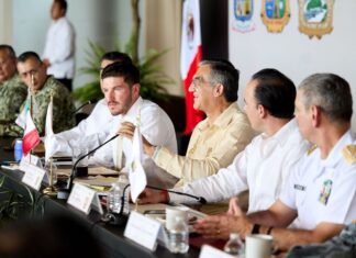 several men seated at a dais