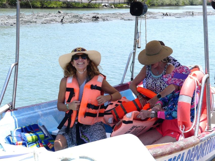 Women on a boat wearing life jackets