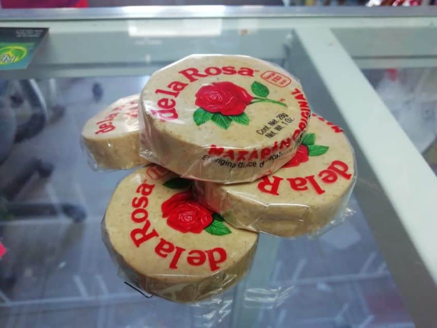 Three De la Rosa mazapan discs sit on a counter