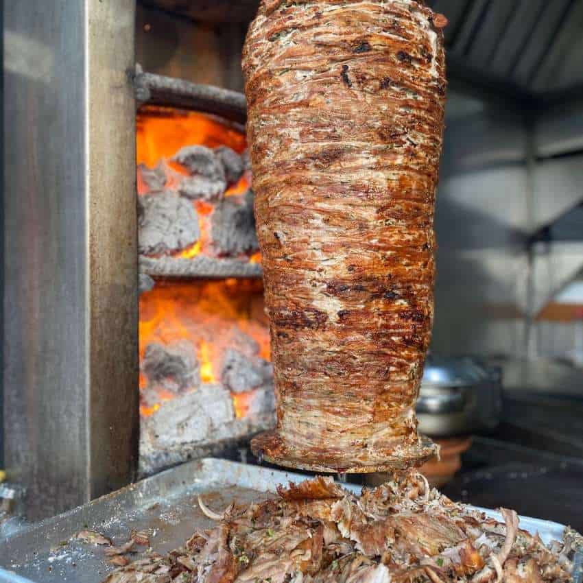An upright meat rotisserie as used for tacos el pastor in Mexico