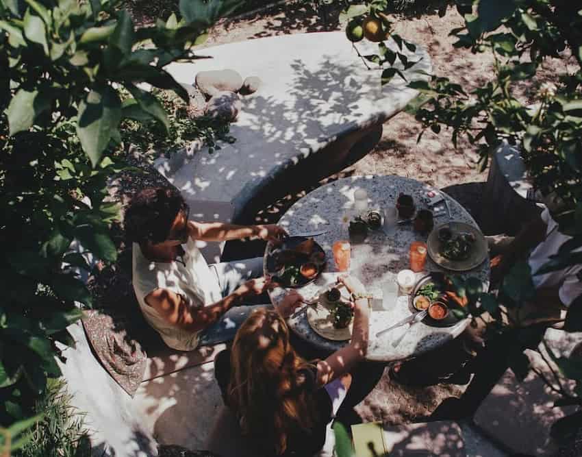 A mates devour and portion successful a plot restaurant.