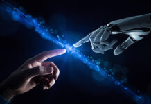 An AI robot hand reaches out to touch a human hand