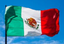 Mexican flag waving from a pole