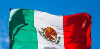 Mexican flag waving from a pole