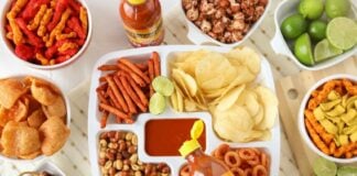 Plate of botanas about to be dressed with botanera sauce