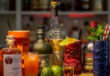 Bottles of liquor and cocktails on a great Mexico City cocktail bar.
